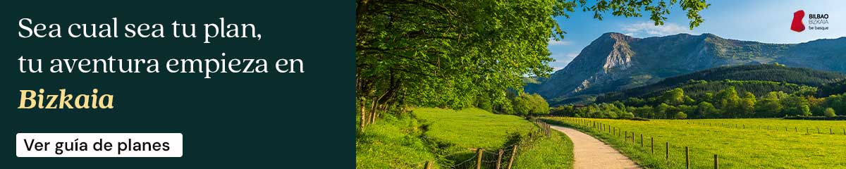 Banner con texto en español: Sea cual sea tu plan, tu aventura empieza en Bizkaia. A la derecha, un camino panorámico discurre entre verdes campos y árboles, con una alta montaña de fondo bajo un cielo azul.