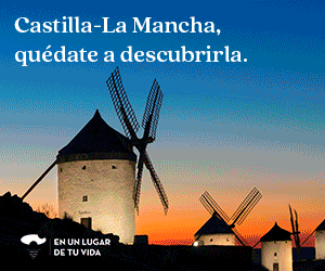 Se ven tres molinos de viento tradicionales al atardecer, con un cielo en tonos degradados. El texto dice: «Castilla-La Mancha, quédate a descubrirla. En un lugar de tu vida...».