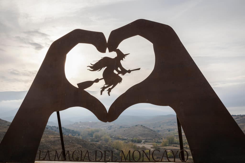 Symbol of a witch in a heart in the town of Trasmoz in Zaragoza, Spain. The peak of Mount Moncayo in the background